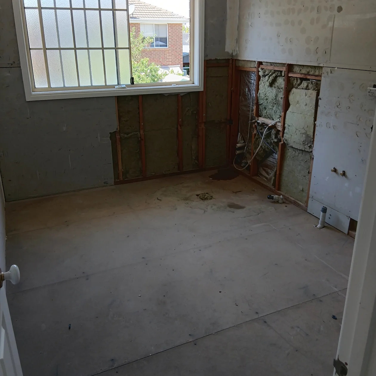 Wall and ceiling opened up to reach failed pipework